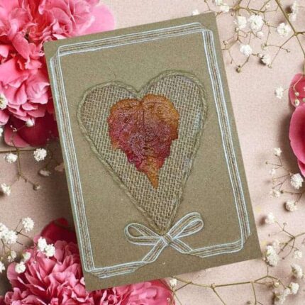 Personalised handmade Valentine's heart card features a heart made from rustic burlap and a natural leaf.