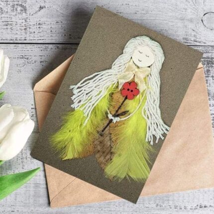 Unique Homemade Birthday Card for Girlfriend made of yellow feathers, white cotton string, and red flower on brown paper.