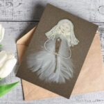 Unique Pure White Feather Handmade Card For Her featuring a pure white feather and a delicate white flower, designed for a special occasion for her.
