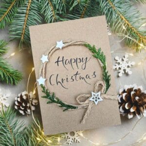 Christmas card design with pine cones and stars, representing the handmade Christmas card category for festive greetings.