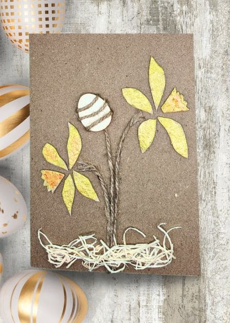 Handmade Easter card displaying a flower and eggs on a brown background, part of a collection banner.