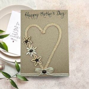 Handmade Mother's Day card featuring colourful flowers and a heart design, celebrating love and appreciation for mothers.