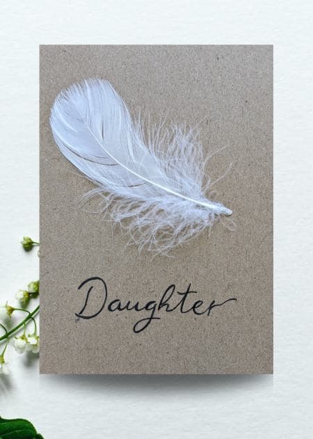 Handmade sympathy card featuring a daughter of the bride message adorned with a delicate feather design, part of a handmade collection.
