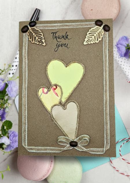 Banner for a handmade thank you card collection, displaying a card with a heart and flower motif.