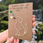 Handmade Unique Birthday Card for Dog Lovers with string art of a dog, in front of a scenic outdoor waterfall background.