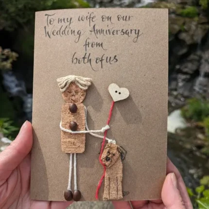 Handmade wedding anniversary card for my wife - from both of us. Card is held in the hand and the style shows a waterfall.