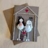 Personalised new home card with two figures made from seashells, twine, and a pink heart 2.