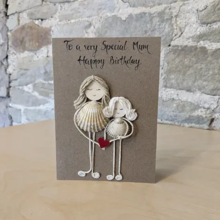 Personalized handmade birthday card for mum with creative seashell figures, ideal for a special birthday greeting.