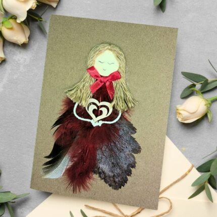 Special Personalised Birthday Card for Her, made of feathers and dried leaves with a wooden heart.