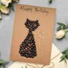 Handmade cat birthday card made with coffee beans and jute string on kraft paper, eco-friendly design for cat lovers.