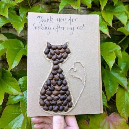 Handmade cat birthday card featuring a rustic cat silhouette crafted from real coffee beans and natural twine, sustainable handmade greeting.
