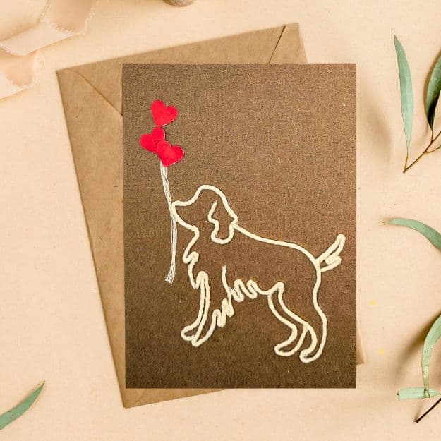 Handmade dog card featuring stitched outline and red heart balloons, a handmade unique card for dog or cat lovers, ideal for birthdays or special occasions.