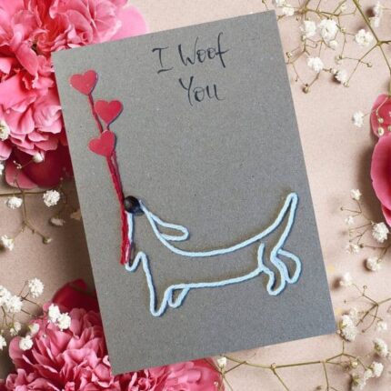 Handmade Dog Mum Valentine's Card featuring a puppy silhouette holding red heart balloons with "I Woof You" text.