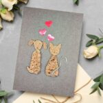 Handmade Dog and Cat Valentine’s Card - A unique, mixed-media greeting featuring textured cork animal art and a twine tail, perfect for pet lovers.