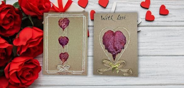 Set of handmade Valentine’s Day cards with layered paper hearts and cotton string, unique romantic greeting cards on kraft card for her or him.