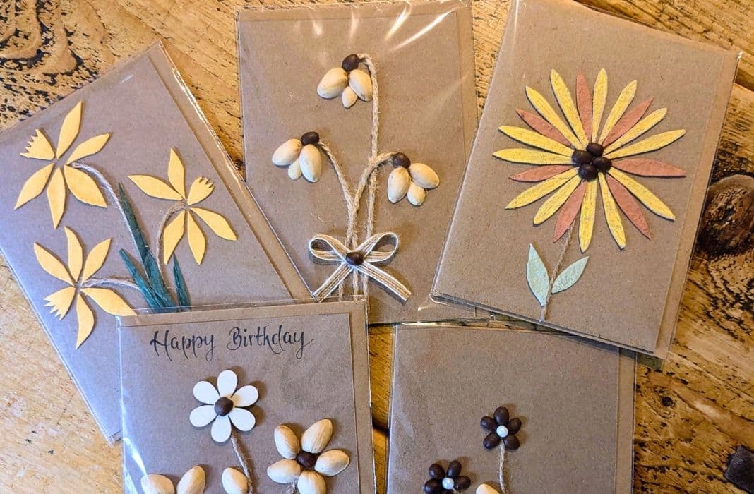 Types of greeting cards displayed as handmade flower cards, featuring botanical designs created with natural materials and paper elements.